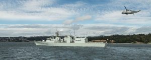 HMCS VANCOUVER is on it’s way to the RIM Pacific Exercise followed by a WESTPLOY Exercise, as a CH-124 Sea King helicopter flies overhead at Dunz Head, CFB Esquimalt on June 13. Photo by Cpl Brent Kenny, MARPAC Imaging Services