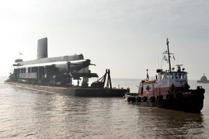 HMCS Ojibwa is towed into Port Burwell Nov. 20, 2012, on the north shore of Lake Erie prior to making its way to the Elgin Military Museum.