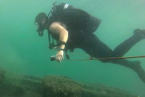 A diver selected to survey USS Arizona swims slowly alongside the decaying ship. Photos courtesy LS Joe Falletta