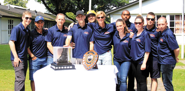 Members of MARPAC’s marching team display the Woodhouse Trophy they were awarded after the completion of the Nijmegen March in Holland, July 19 to 22.