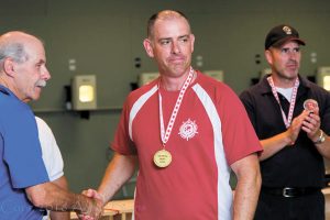 Captain Mark Hynes takes the gold medal for 25m Standard Pistol shooting at the 2016 Canadian National Pistol Championships in Toronto. Photo by Aaron Burns