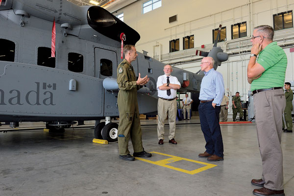 Members of the Royal United Services Institute of Nova Scotia and the Royal Canadian Air Force Association visited 12 Wing Shearwater Aug. 10 to learn more about the Block 1.0 and 1.1 phases  of the CH148 Cyclone helicopter at 12 Air Maintenance Squadron. Photo by Cpl Felicia Ogunniya, 12 Wing Imaging Services