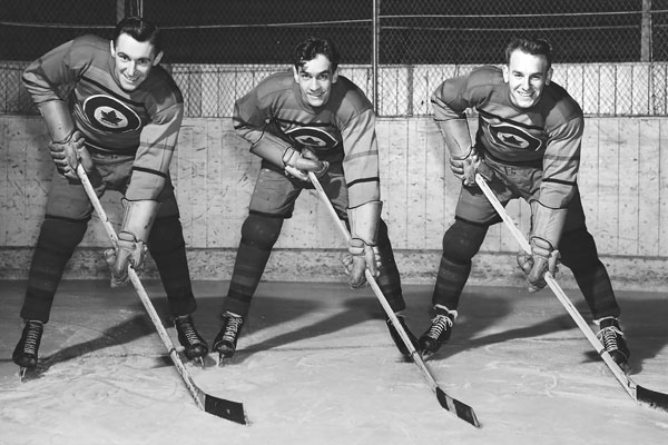 Ab Renaud (left), Ted Hibberd and Reg Schroeter strike a pose for their 1948 RCAF Flyers players card photograph. Photos Courtesy of Tim Schofield