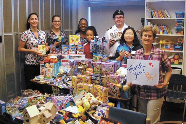 A mountain of toys were delivered to the Victoria General Hospital from money raised at 18th annual Dave Barber Golf event. Pictured from left to right: Tarraneh Bouchard, Megan Schulz, Amanda Blanchard, Kaydra Blanchard, PO2 Dave Blanchard, Theresa Low and Diane Edwards.