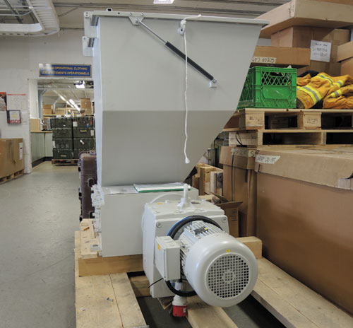 The main component of the JBF Machine Company of Germany’s shredding machine in Dockyard’s Base Logistics Building. The 2,425lbs machine is capable of shredding non-operational military uniforms in seconds. Photo by Peter Mallet, Lookout