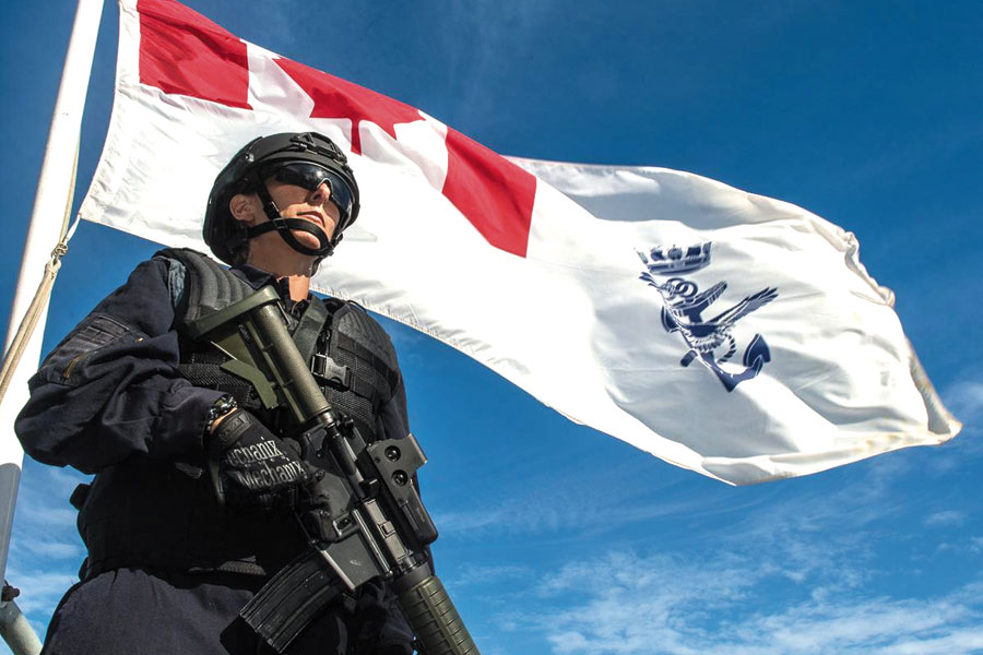 Photo taken for a Naval Security Team recruitment poster, Sept. 7 on HMCS Edmonton. Photo by Cpl Andre Maillet, MARPAC Imaging Services