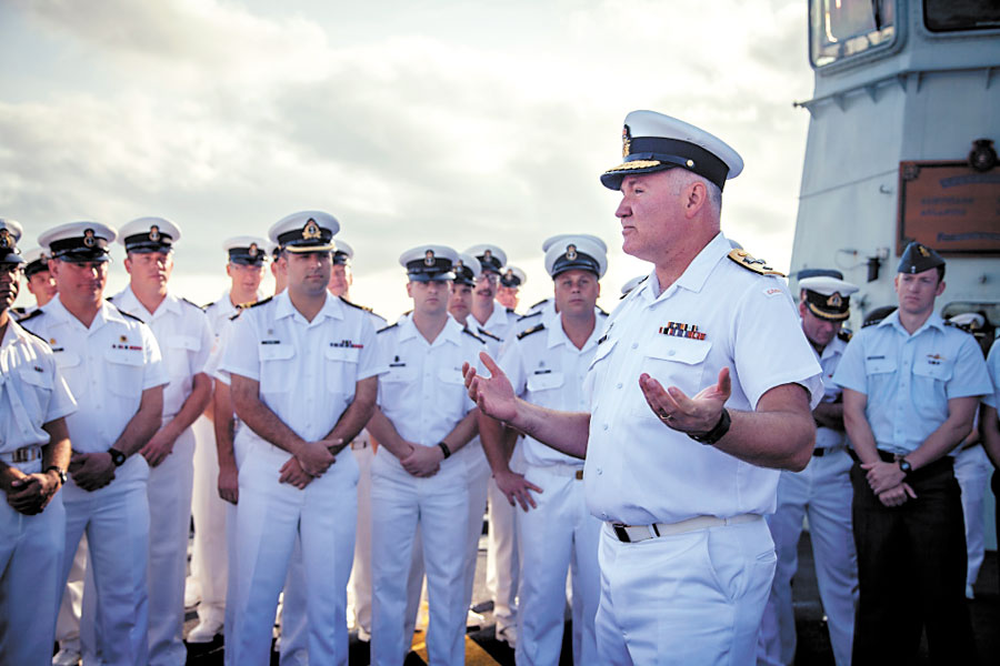 Cmdre Buck Zwick addresses Vancouver crew members on the flight deck Sept. 14, prior to the ship sailing for Australia.