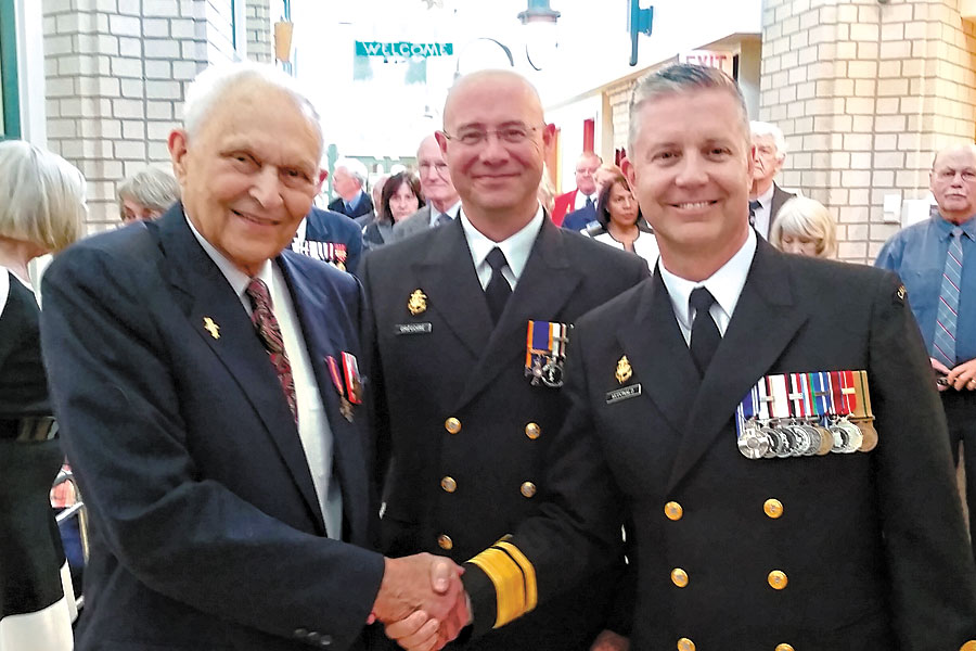 Rudi Hoenson meets with CPO1 Gilles Grégoire and RAdm Art McDonald during a war medals presentation ceremony for Hoenson at the Veterans Memorial Lodge at Broadmead, Oct. 7. Photo by Peter Mallett, Lookout Newspaper