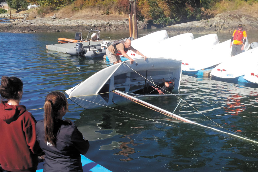 One important lesson before sailing is knowing how to right an overturned sail boat. This was part of the Soldier On sail training experience.