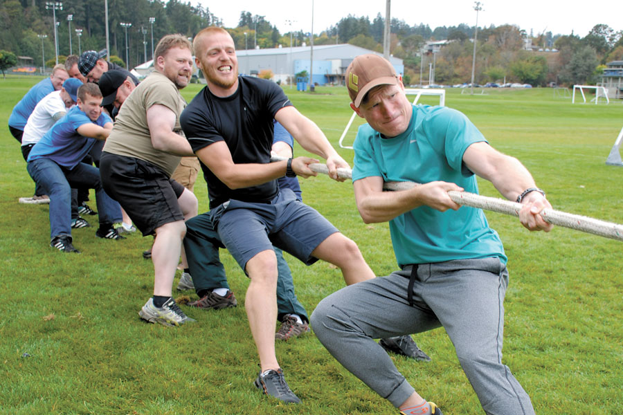 PO1 Jonathan Sorensen leads his team in the tug-of-war competition. Photos by Peter Mallett, Lookout Newspaper