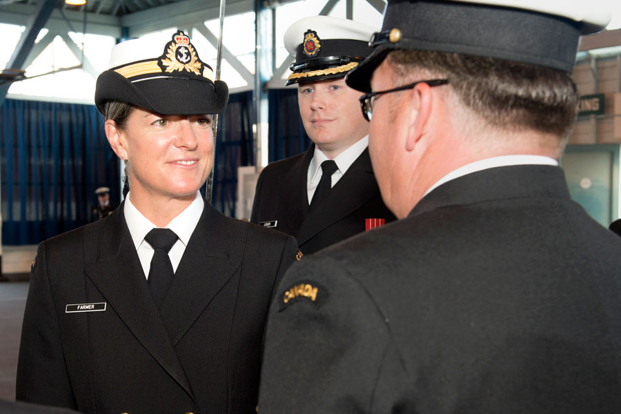 HCapt(N) Mandy Farmer inspects a member of Alpha Platoon during Base Divisions. Photo by LS Ogle Henry, MARPAC Imaging Services