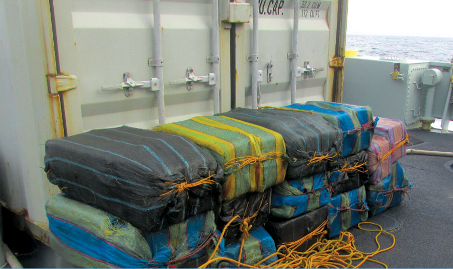 Fourteen bales of cocaine weighing an estimated 700 kilograms rest on the sweep deck of HMCS Brandon after being jettisoned by a suspected smuggling vessel, a small fishing boat known as a panga, off the Pacific coast of Central America during Operation Caribbe on Nov. 5. Photo by U.S. Coast Guard