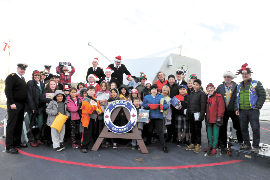 Esquimalt school children gather with crew of HMCS Calgary and members of the Esquimalt Lions Club aboard HMCS Calgary, Dec. 8 2016. Photo by Peter Mallett, Lookout