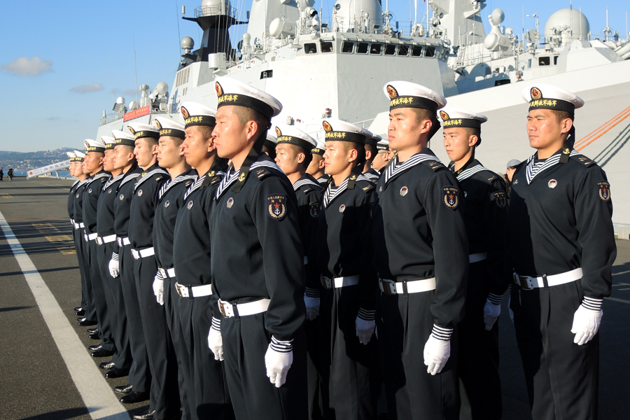 Sailors from the People’s Liberation Army stand at attention as they prepare for inspection in front of missile frigate Yancheng. Photo by Peter Mallett, Lookout Newspaper