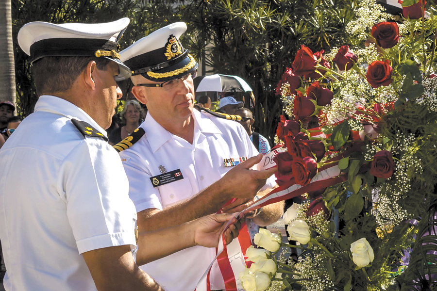 Capt Federico N. Garcia Leyva and Cdr Yves Tremblay release the ribbon for the commemoration wreath for José Marti in Havana, Cuba, on Nov. 20. Photo by Corporal Kenneth Galbraith, Formation Imaging Services