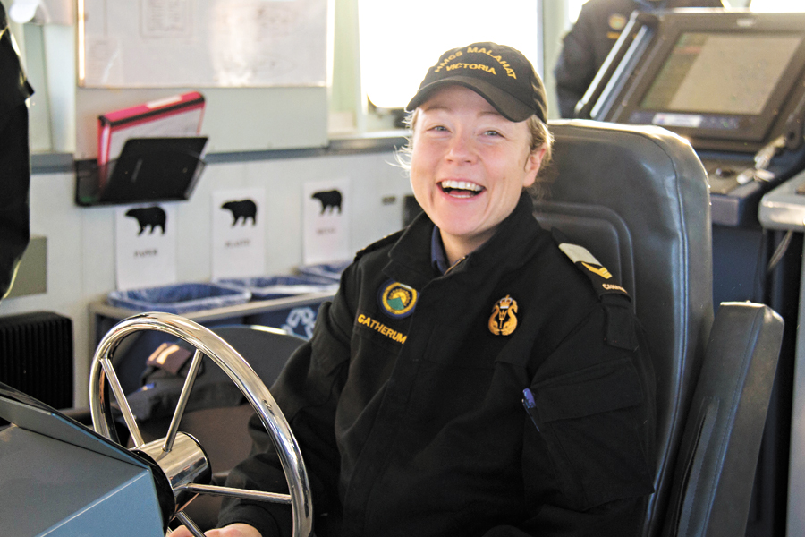 Leading Seaman Christine Gatherum enjoys her first time at the helm of PCT Grizzly. Photo by Lt(N) Anne Gardam