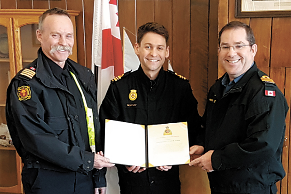 LCdr Clark Northey is joined by his father Robert Northey (left) and LCdr Trent Nichols for his promotion to his current rank and the awarding of a Canadian Joint Operations Command, Commander’s Commendation.