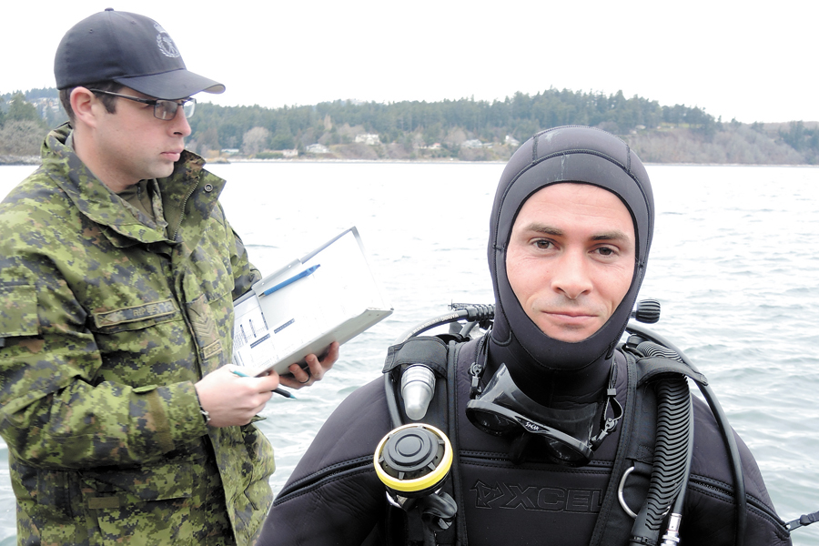 U.S. Army diver First Lieutenant Josh Voorhees prepares for a search and recovery procedure during Exercise Roguish Buoy 2017 at the Albert Head Training Centre.