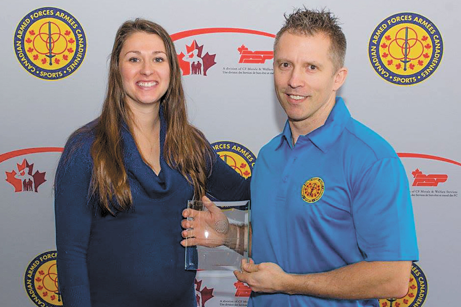 CPO2 Ken Simoneau of Naval Fleet School (Pacific) receives the CAF Old Timer’s National Hockey Championship Sportsmanship Award from Jessica Taillefer. Photos by CFB Borden Base Imaging