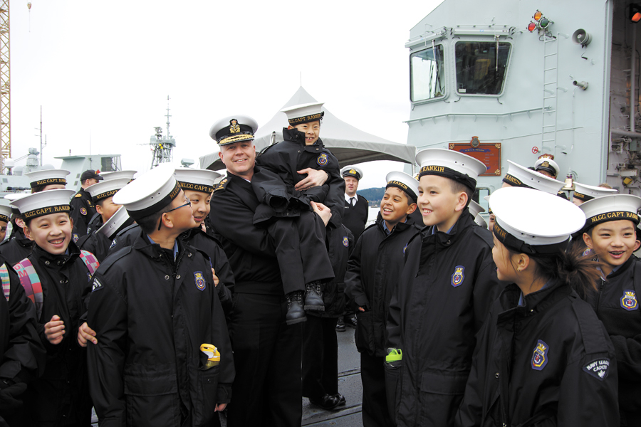 Little Ordinary Cadet Connor Tse couldn’t see over the heads of his Cadet friends until Rear-Admiral McDonald picked him up and held him high above his colleagues. Photo by Deborah Morrow