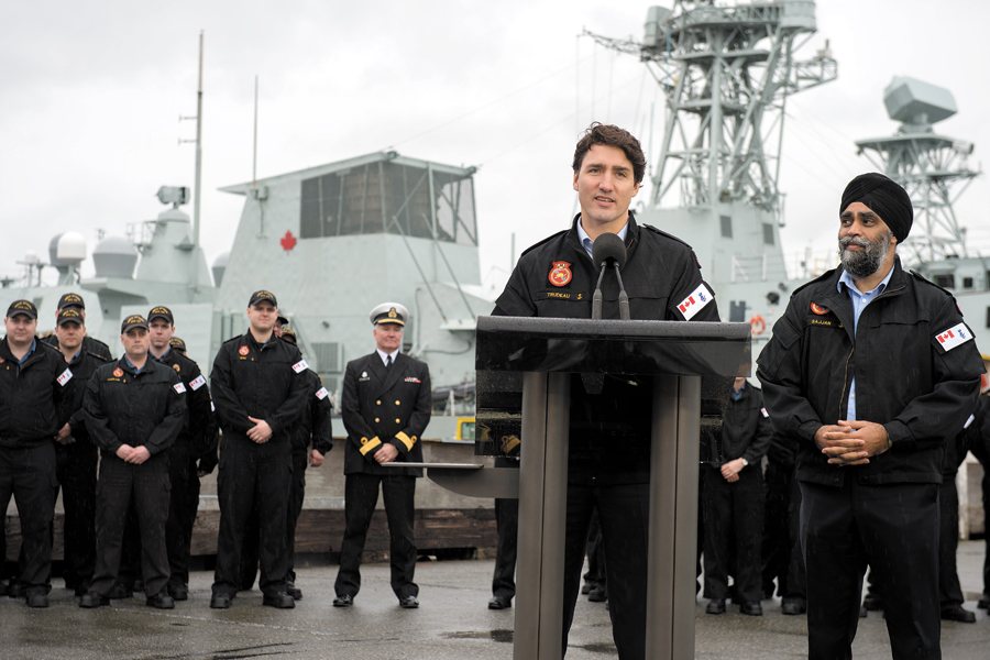 With HMCS Ottawa and its crew in the background, Justin Trudeau, Prime Minister of Canada, and Harjit Sajjan, Minister of National Defence, take part in a press conference at CFB Esquimalt on March 2. Photo by MCpl Chris Ward, MARPAC Imaging Services