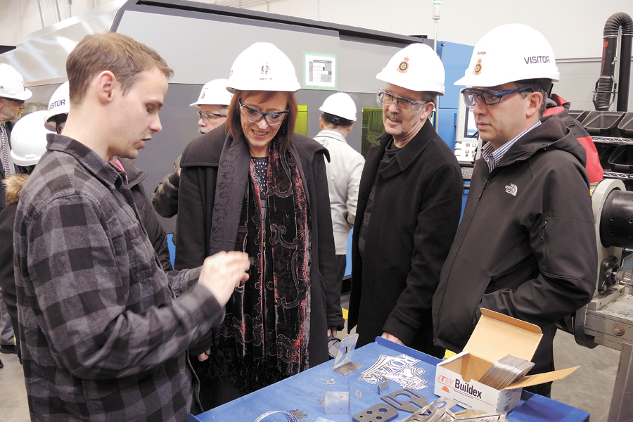 Chris Roy, a sheet metal fabricator who works in the Fleet Maintenance Facility HMCS Cape Breton, displays a project he is working on to a delegation of B.C. mayors. Photo by Peter Mallett, Lookout Newspaper