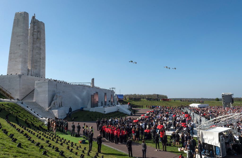 Five replica aircraft from Vimy Flight fly past the Canadian National Vimy Memorial during the signature ceremony to mark the 100th anniversary of the Battle of Vimy Ridge in Vimy, France on April 9, 2017. Photo by MCpl Jennifer Kusche, CF Combat Camera