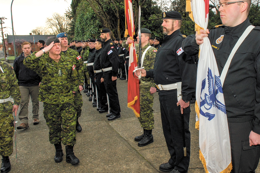 General Vance salutes the Colour Party (right) before inspecting the Guard of Honour at Duntze Head. Photo by Cpl Blaine Sewell, Formation Imaging Esquimalt