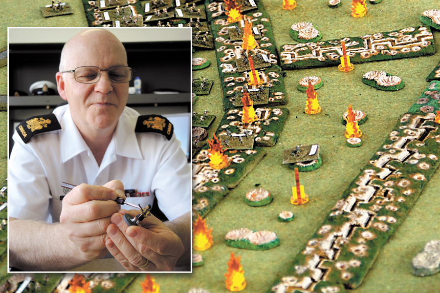 CPO1 Shawn Taylor touches up a miniature Blackwatch Highlander soldier used in his replica model of the Vimy Ridge battlefield. CPO1 Taylor and his collegue Robert Dunlop were invited to display their work at the Canadian War Museum in Ottawa over the April 8 weekend. Photo by Peter Mallett, Lookout