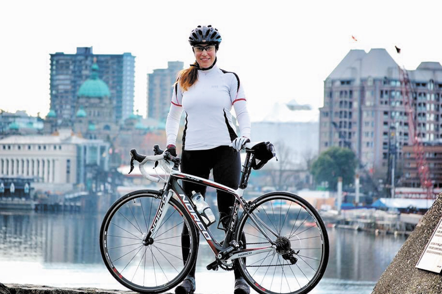 Captain Zweng with her bike at Victoria’s Inner Harbour. She is leading a team of 20 Victoria-based cyclists in the Wounded Warriors Canada’s Battlefield Bike Ride. Photo by Jimmy Tran