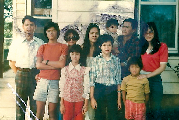 Clockwise: Ho Mai Linh’s mother (in the red top), cousin Chau, Ho Mai Linh, cousin Thuy, cousin Chuong, Uncle #15, Aunt #4, Aunt #16, and Ho Mai Linh’s brother and father in Windsor.