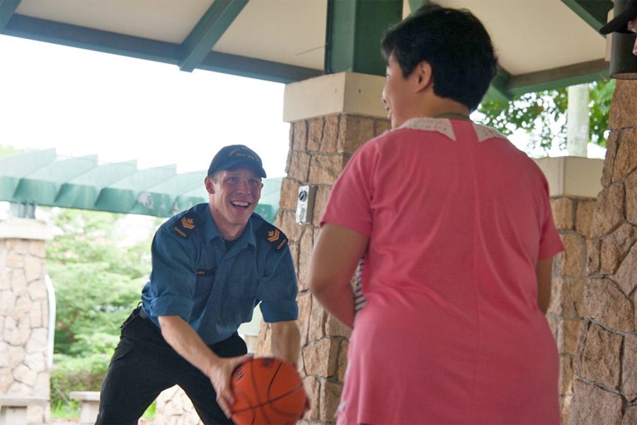 MS Kevin Simons joins in a sports activity at the Ang Mo Kio Training and Development Centre.