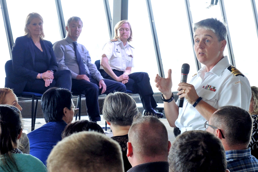 LCdr Judith Harlock from Joint Personnel Support Unit addresses the audience during the town hall. Background from left: Jody Thomas, Senior Associate Deputy Minister and DND Mental Health Co-Champion, Jerry Ryan, Federal Government Dockyard and Trades and Labour Council (East), and Commodore Marta Mulkins, Commander Navy Reserves. Photo by Peter Mallet, Lookout