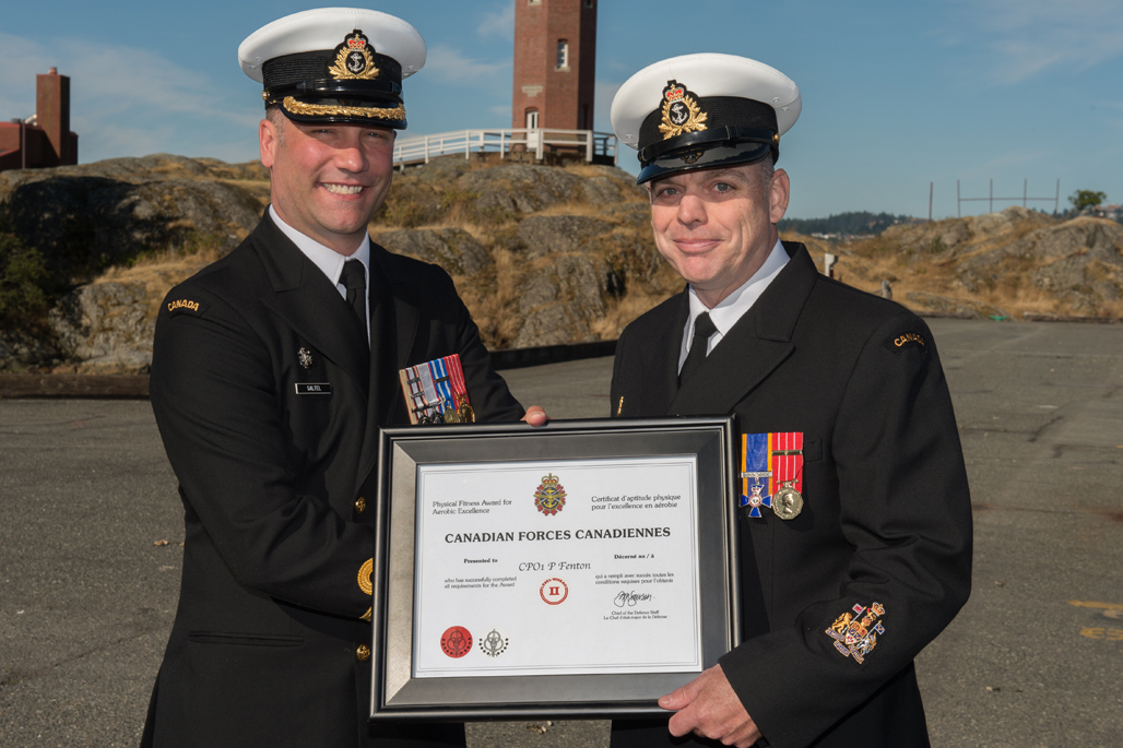 CPO1 Paul Fenton is presented the Canadian Forces Physical Fitness Award for Aerobic Excellence White Seal.