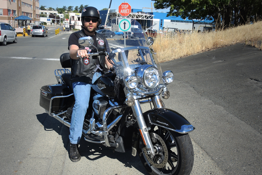 LS Michael Hodgson shows off his Harley Davidson Road King at a parking lot in Dockyard. He will join 300 riders in the Military Police National Motorcycling Relay and will ride his bike from Victoria to Jasper, Alberta, the first leg of the coast-to-coast fundraiser for visually impaired children. Photo by Peter Mallett, Lookout Newspaper