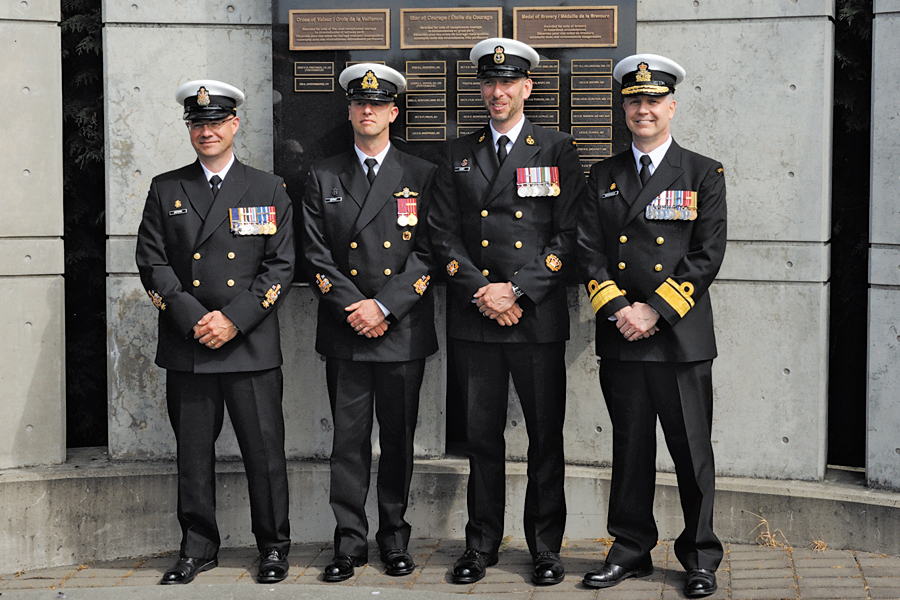 From left to right: Chief Petty Officer First Class Gilles Gregoire, Formation Chief; CPO1 Robert DeProy, Petty Officer Second Class Andre Aubry, and Rear-Admiral Art McDonald, Commander Maritime Forces Pacific, at the Wall of Valour monument June 26. Photo by Ed Dixon, MARPAC Imaging Services