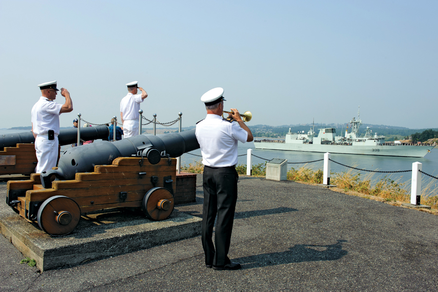 Commander of Maritime Forces Pacific, Rear-Admiral Art McDonald (centre), salutes HMCS Winnipeg as the ship arrives at CFB Esquimalt. Photo by LS Sisi Xu, MARPAC Imaging Services