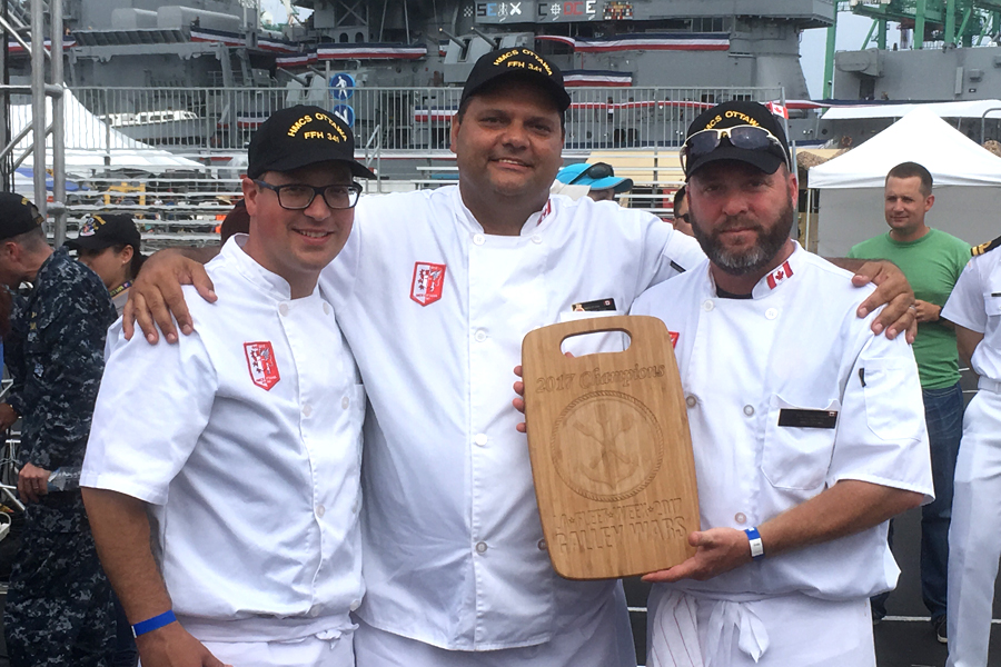 MS DJ Fields, PO1 John Cross and PO2 Pierre Forget hold their Galley Wars award.