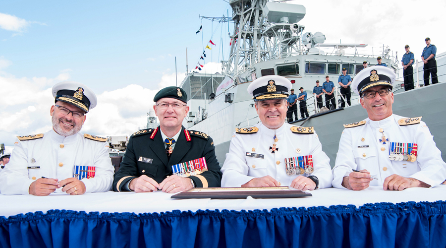 RAdm Craig Baines, LGen Steve Bowes, VAdm Ron Lloyd, and RAdm John Newton sign the MARLANT Change of Command certificates during the ceremony Sept. 1. Photo by Mona Ghiz, MARLANT PA