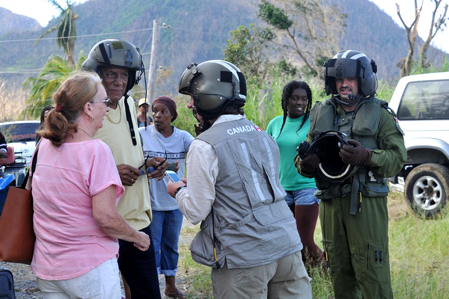 Rosemary and Howard Shillingford, left, are greeted by GAC personnel and members of HMCS St. John’s Sea King detachment in Dominica to be airlifted to Douglas-Charles Airport on Sept. 24. Photo by HMCS St.John’s Air Detachment