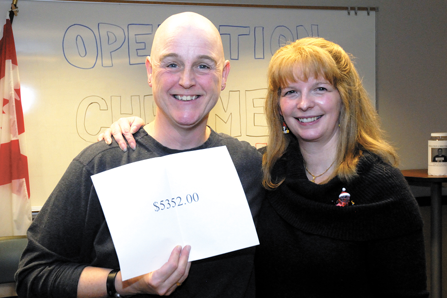 Commanding Officer of Joint Personnel Support Unit Pacific, Lieutenant-Commander Judith Harlock (left) is joined by Petty Officer Second Class Fiona Borland after LCdr Harlock shaved her head last December as part of Operation Chrome Dome. The fundraiser for cancer research through the National Defence Workplace Charitable Campaign (NDWCC) is back again this year with LCdr Harlock agreeing to go bald if $10,000 can be raised prior to Dec. 14. Photo by JPSU Pacific/file