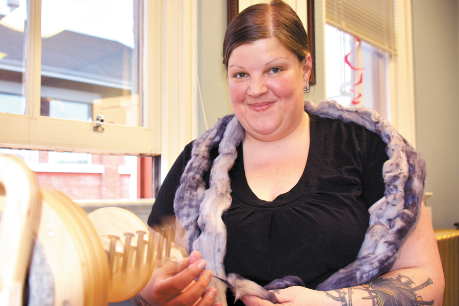 Emjay Bailey hopes to spin enough yarn to stretch from the Base Commander’s building in Naden to the Admiral’s Office in Dockyard. The yarn will then be given to a local knitting group that produces warm clothing for disadvantaged youth and the homeless.