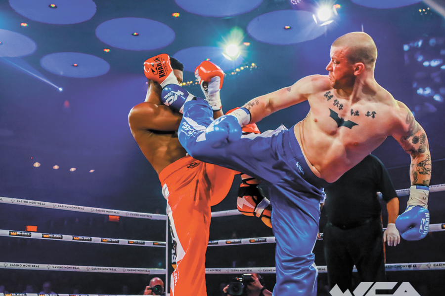 PSP Fitness and Sports Instructor Thomas Dalziel, right, got his first pro kickboxing victory on Dec. 18, 2017, in a main-event match American fighter Ravon Baxter of Nashville during the World Combat Arena fight card at the Montreal Casino. Photo courtesy of Manseau Sports Photos