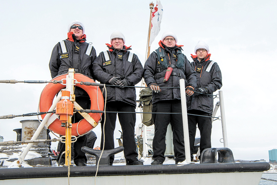 HMCS St. John’s crewmembers line the rails as the ship departs Halifax on Operation Reassurance.