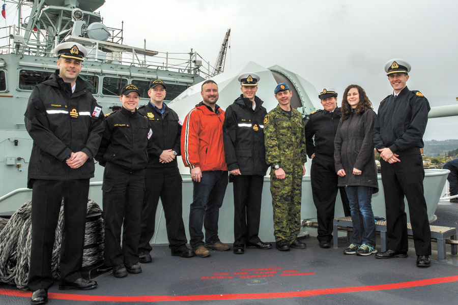 Team “Onward” on HMCS Calgary, 57mm main gun in the background. From left to right: Lt(N) Adam Thomson, Lt(N) Sonja Maul-Wilson, SLt Sean Place, Adam Checketts, Team captain Lt(N) Sean Milley, Team captain Warrant Officer Steven Lewington, Lt(N) Cass van Benthem Jutting, Dusty Johnston, and Lt(N) Alex Johnston. Absent: Third team captain Lt(N) Stephen Tomlinson, who is undergoing treatment.