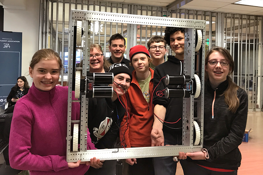 Team members who attended the official robotics competition startup Jan. 6 in Vancouver hold the base of the robot they put together that day. It has come a very long way since then. Photo courtesy Tina O’Keeffe