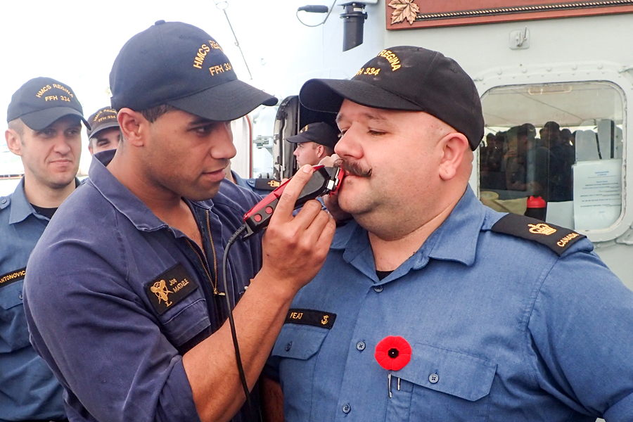 It was 20 years in the making, and a mere minute to lose, but it was all worth it in the end. PO1 Darren Peat’s mustache succumbed to a $,6,225 fundraising goal, and the sailor braved the shaved on HMCS Regina’s flight deck. Photo courtesy HMCS Regina