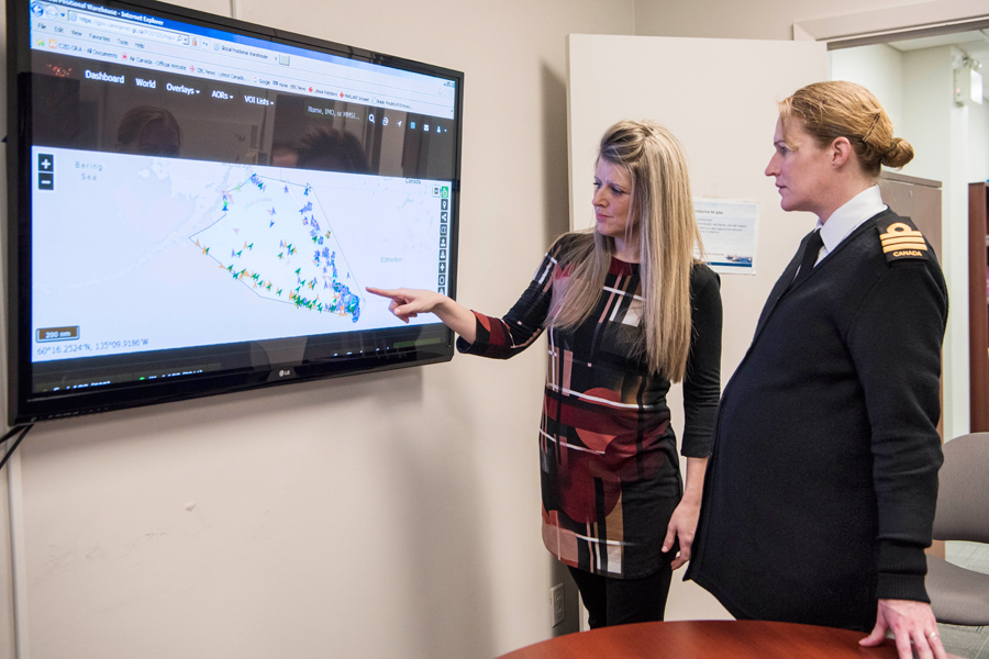 Alicia Hogue, a Programmer with the Royal Canadian Navy, demonstrates ship tracking software for Commander Seana Routledge of MARLANT’s Base Information Services on Feb. 2 at HMC Dockyard Halifax. Photo by Mona Ghiz, MARLANT PA