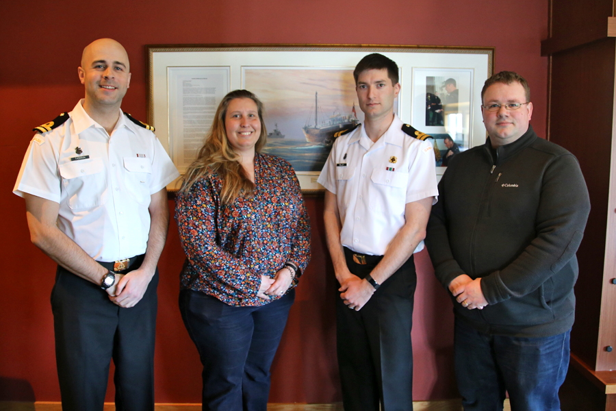 For nearly a decade, the snake pit of the gunroom has been known as “TK’s”, dedicated to Lt(N) Cameron Tkachuk. Lt(N) Tkachuk succumbed to cancer on Aug. 31, 2008. Team Onward posed in front of the print of naval artist John Horton presented to the Gunroom on his behalf. Pictured here: Lt(N) Adam Thomson, Lt(N) Cass van Benthem Jutting, Lt(N) Sean Milley and Lt(N) Stephen Tomlinson. Photo by SLt Déry