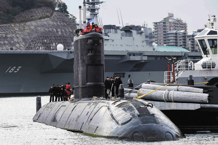 The crew of HMCS Chicoutimi prepare to disembark in Yokosuna, Japan, while deployed on Poseidon Cutlass 17.